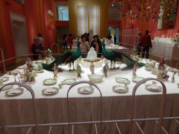 Miaomiao and Mengjin with items from the Berlin Dessert Service at the exhibition `Dining with the Tsars` at the Main Hall at the First Floor of the Hermitage Amsterdam museum