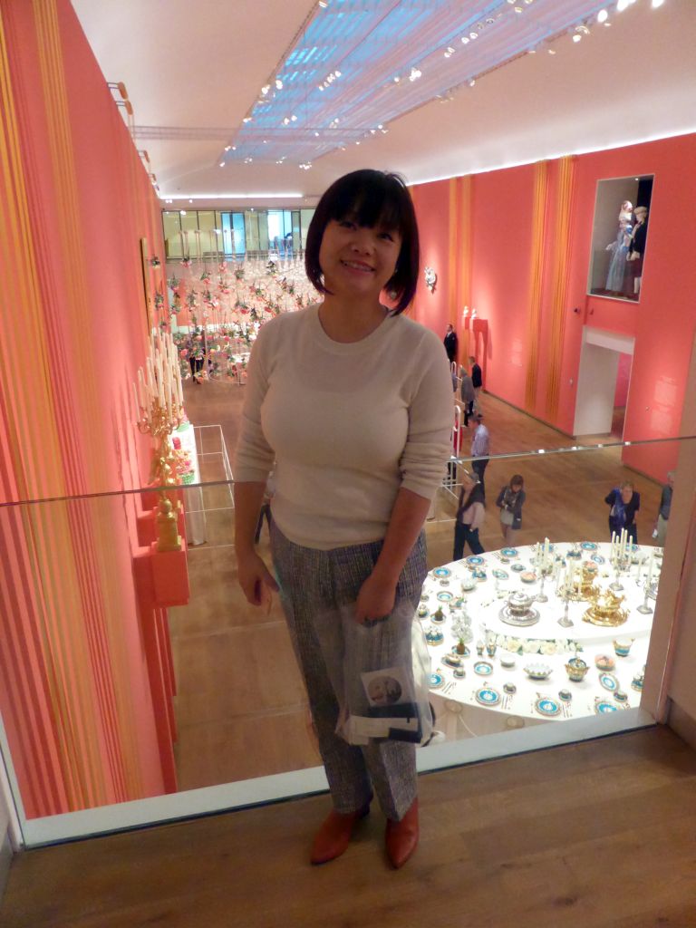 Miaomiao at the Second Floor of the Hermitage Amsterdam museum, with a view on the Services in the Main Hall at the First Floor at the exhibition `Dining with the Tsars`