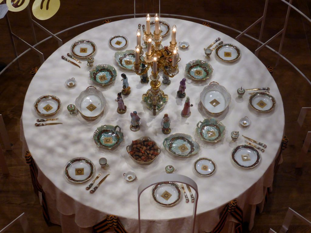 Items from the Service of the Order of St. George, at the exhibition `Dining with the Tsars` at the Main Hall at the First Floor of the Hermitage Amsterdam museum, viewed from the Second Floor