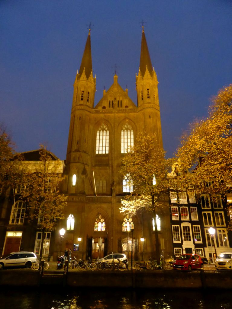 Front of the Krijtberg church at the Singel canal, by night