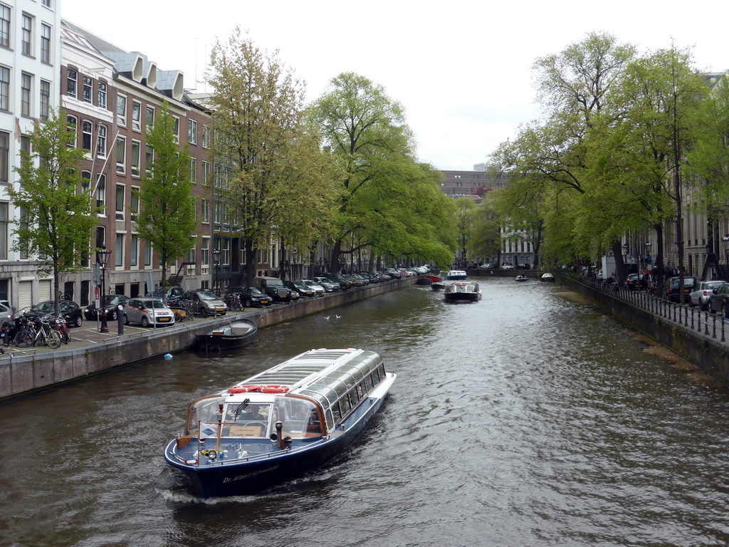 Boats in the Herengracht canal, viewed from the bridge at the Koningsplein square