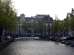 Boats in the Herengracht canal, viewed from the bridge at the Koningsplein square