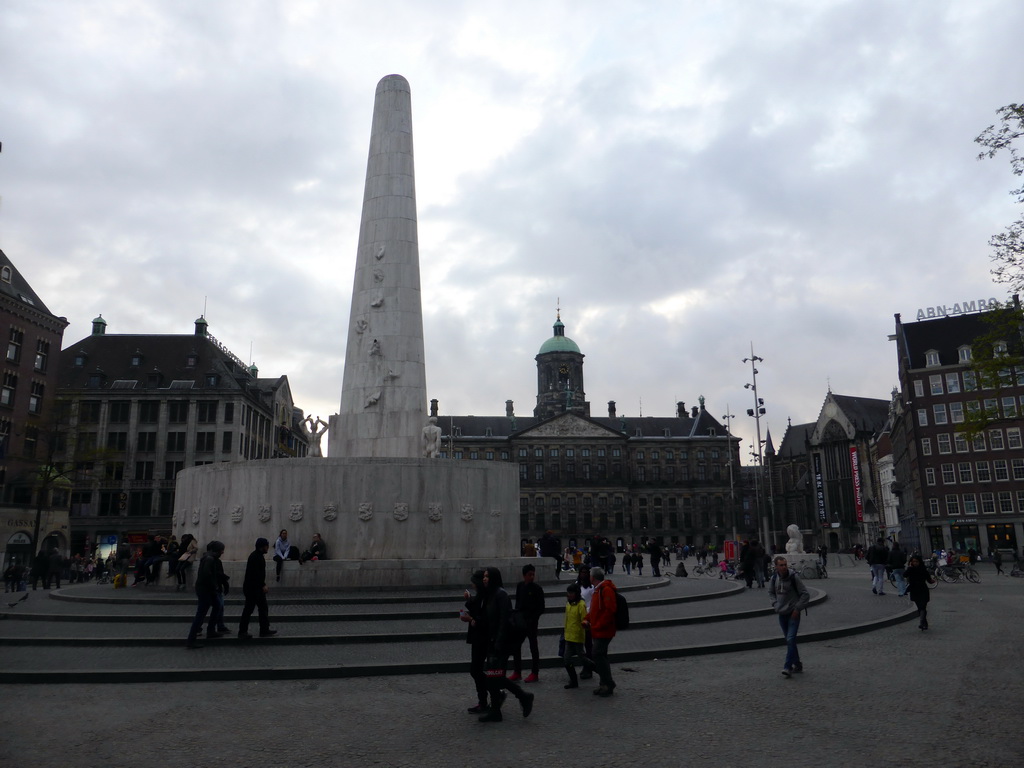 The Dam square with the Nationaal Monument and the front of the Royal Palace Amsterdam, at sunset