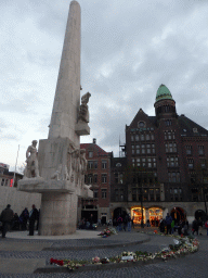 The Nationaal Monument at the Dam square, with flowers from the Remembrance of the Dead, at sunset