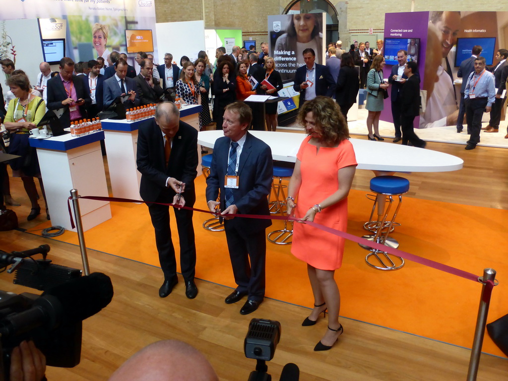 Vytenis Andriukaitis, Steve Lieber and Edith Schippers cutting a ribbon at the opening ceremony of the eHealth Week 2016 conference at the Graanbeurszaal room of the Beurs van Berlage conference center