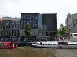Boats in the Prinsengracht canal, the front of the Anne Frank House museum and the Westerkerk church