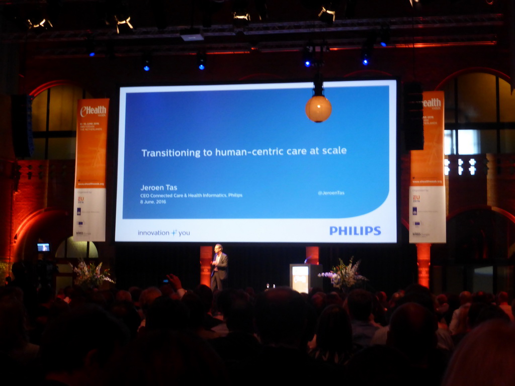 Presentation `Transitioning to human-centric care at scale` by Jeroen Tas during the eHealth Week 2016 conference, in the Effectenbeurszaal room of the Beurs van Berlage conference center