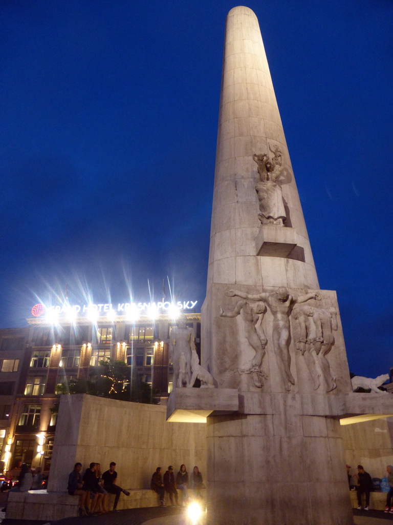 The Nationaal Monument and the front of the Grand Hotel Krasnapolsky at the Dam Square, by night