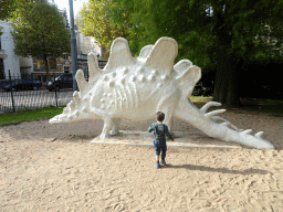 Max with a Stegosaurus statue at the south side of the Royal Artis Zoo