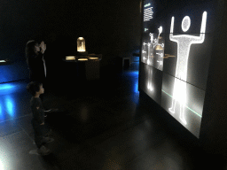 Max playing with the motion-controlled information screen at the Upper Floor of the Micropia museum