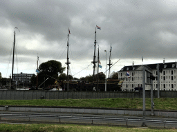 The Oosterdok canal and the National Maritime Museum with the replica of the `Amsterdam` ship, viewed from the Oosterdok street