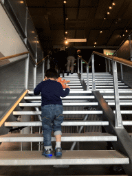 Max on the staircase from the Ground Floor to the First Floor of the NEMO Science Museum