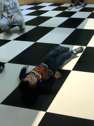 Max on the floor of the Trick Your Brain game at the Technium exhibition at the Second Floor of the NEMO Science Museum