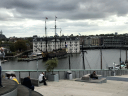 The Oosterdok canal and the National Maritime Museum with the replica of the `Amsterdam` ship, viewed from the roof at the Fifth Floor of the NEMO Science Museum