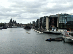 The Mr. J.J. van der Veldebrug bridge over the Oosterdok canal, the Basilica of St. Nicholas, the Amsterdam Central Railway Station, the Sea Palace Restaurant and the Conservatory of Amsterdam, viewed from the roof at the Fifth Floor of the NEMO Science Museum