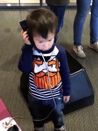 Max with a telephone at the Humania exhibition at the Fourth Floor of the NEMO Science Museum