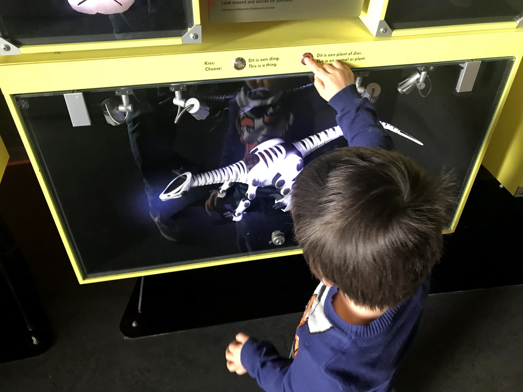 Max with a robot dinosaur at the Elementa exhibition at the Third Floor of the NEMO Science Museum