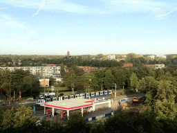 Tram at the Beneluxbaan street of Amstelveen and the tower of the St. Augustinuskerk church, viewed from the roof of the Cityden Up hotel