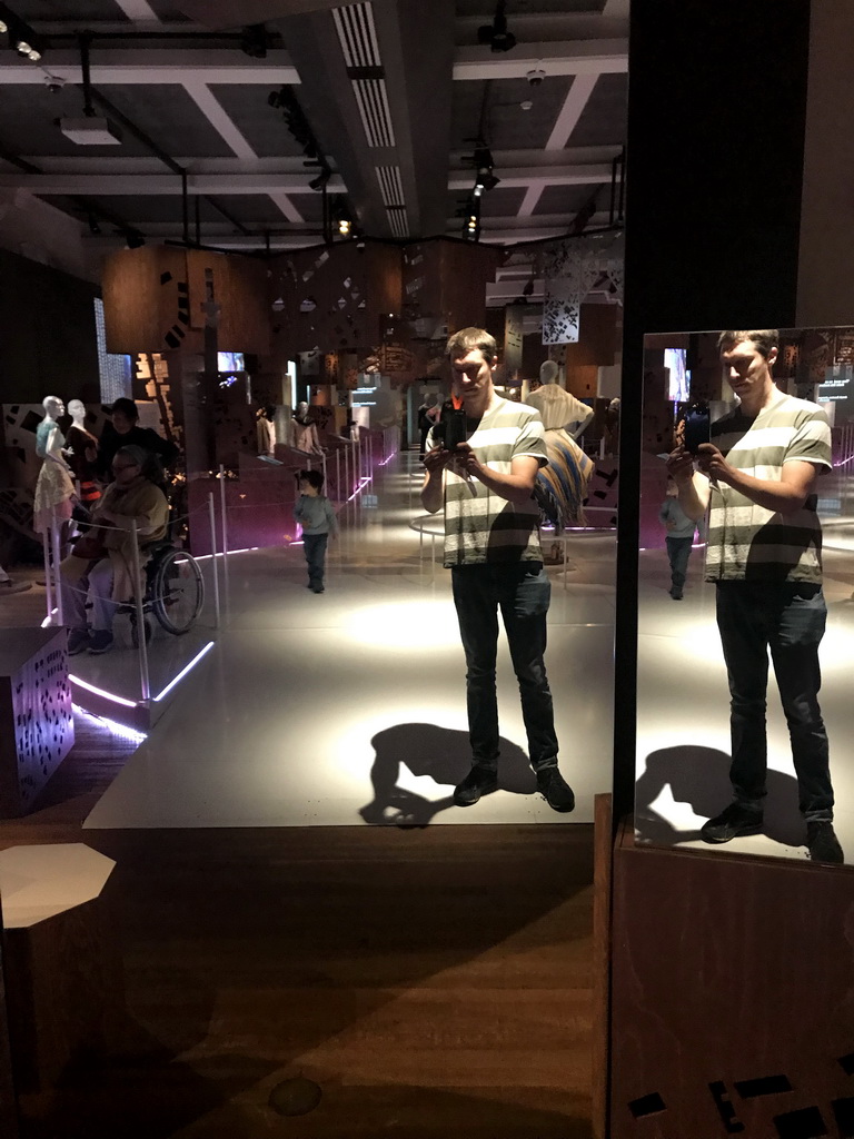 Tim and Max in a mirror at the Fashion Cities Africa exhibition at the Second Floor of the Tropenmuseum