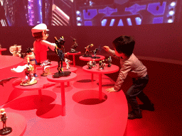 Max with statuettes and movie at the Cool Japan exhibition at the Second Floor of the Tropenmuseum
