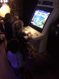 Max with an arcade game at the Cool Japan exhibition at the Second Floor of the Tropenmuseum