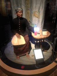 Statue of a person from the Dutch East Indies at the Indonesia exhibition at the First Floor of the Tropenmuseum, with explanation