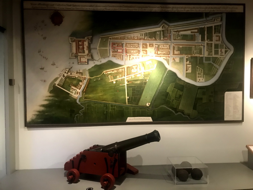Cannon and map of the city of Batavia at the Indonesia exhibition at the First Floor of the Tropenmuseum