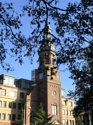 The tower of the Muiderkerk church at the Linnaeusstraat street, viewed from the parking lot of the Tropenmuseum