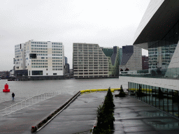 The IJpromenade, the side of the EYE Film Institute Netherlands, the IJ river and buildings at the IJdock area