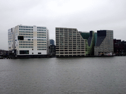 The IJ river and buildings at the IJdock area, viewed from the IJpromenade