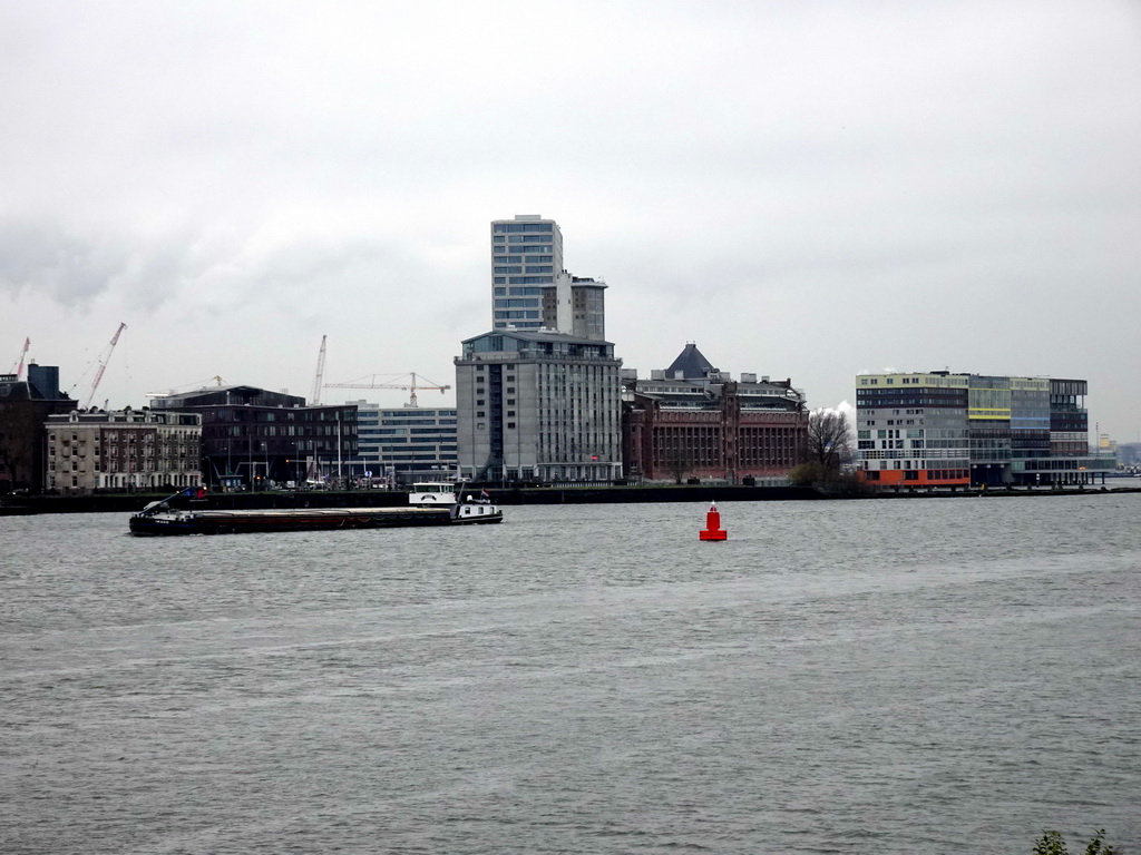 Boat in the IJ river and buildings at the Sliodam area, viewed from the IJpromenade