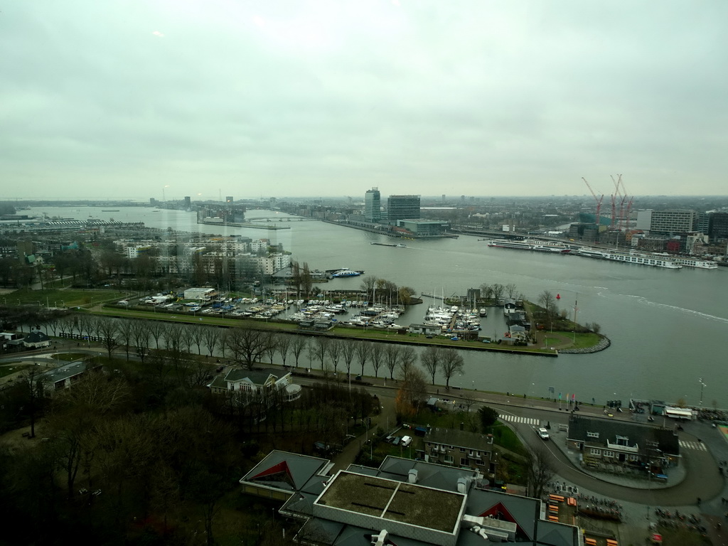 Boats in the IJ river and the east side of the city, viewed from the A`DAM Lookout Indoor observation deck at the A`DAM Tower