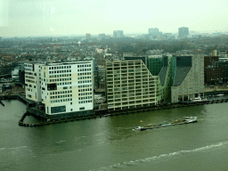 Boat in the IJ river and the buildings at the IJdock area, viewed from the A`DAM Lookout Indoor observation deck at the A`DAM Tower