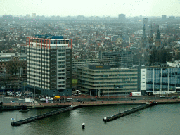 Boats in the IJ river, buildings at the De Ruijterkade street and the Posthoornkerk church, viewed from the A`DAM Lookout Indoor observation deck at the A`DAM Tower