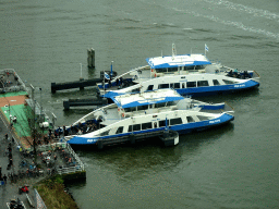 Two ferries at the Buiksloterweg terminal at the IJ river, viewed from the A`DAM Lookout Indoor observation deck at the A`DAM Tower