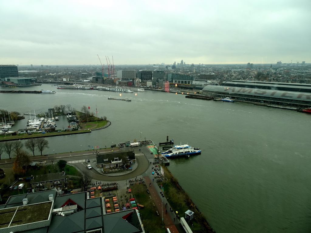 Boats in the IJ river, the Amsterdam Central Railway Station and the east side of the city, viewed from the A`DAM Lookout Indoor observation deck at the A`DAM Tower