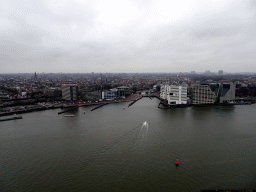 Boats in the IJ river and buildings at the De Ruijterkade street and the IJdock area, viewed from the A`DAM Lookout Outdoor observation deck at the A`DAM Tower