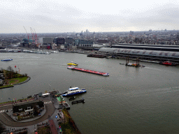 Boats in the IJ river, the Amsterdam Central Railway Station and the east side of the city, viewed from the A`DAM Lookout Outdoor observation deck at the A`DAM Tower