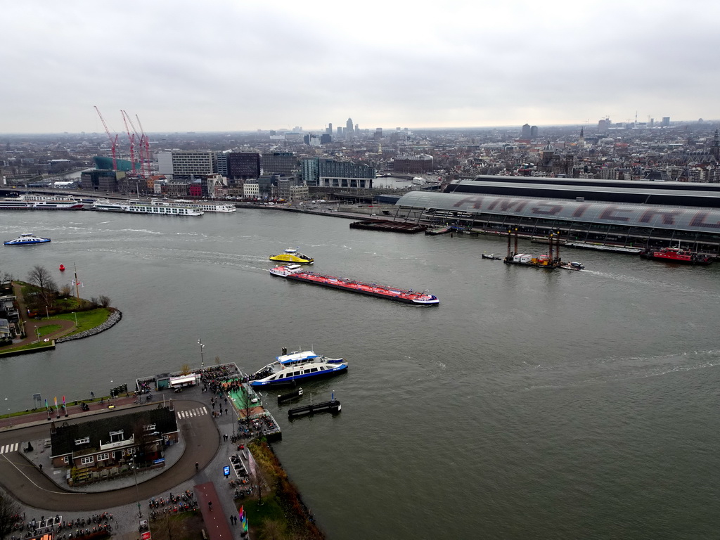 Boats in the IJ river, the Amsterdam Central Railway Station and the east side of the city, viewed from the A`DAM Lookout Outdoor observation deck at the A`DAM Tower