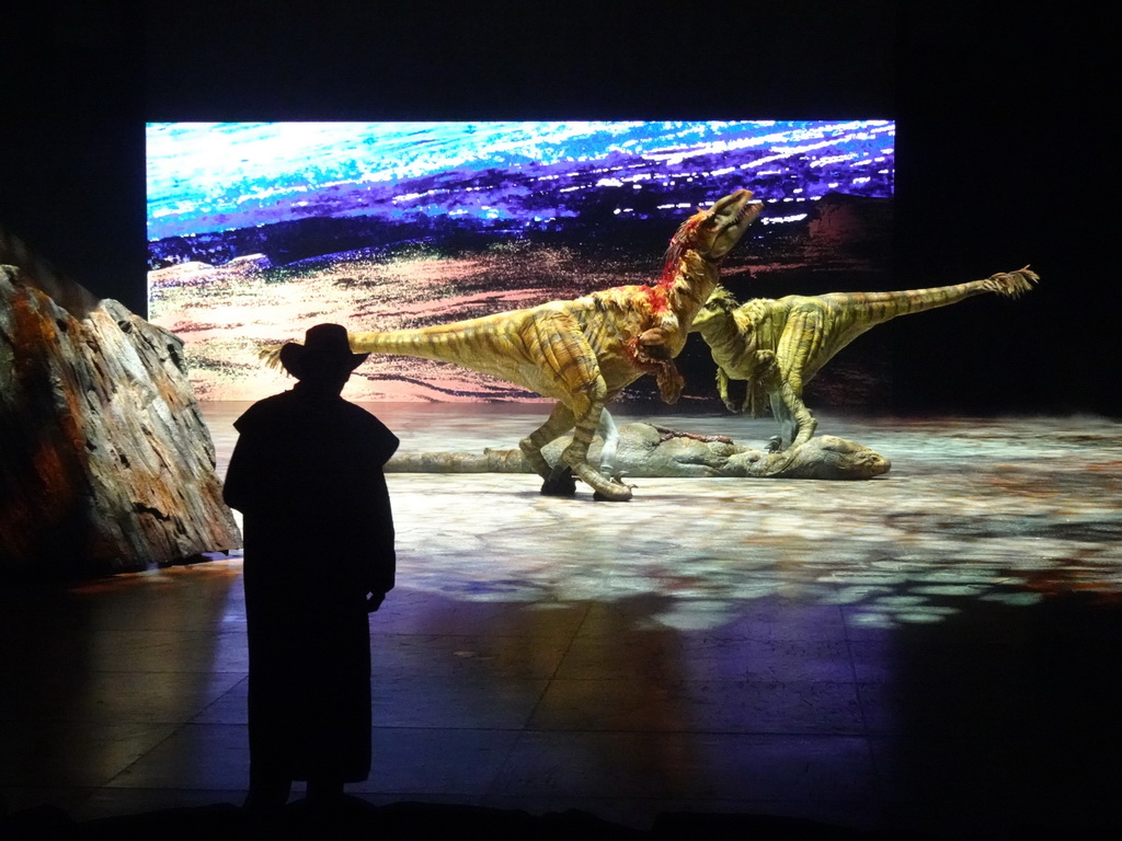 Utahraptor statues and actor at the stage of the Ziggo Dome, during the `Walking With Dinosaurs - The Arena Spectacular` show