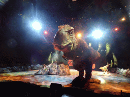 Tyrannosaurus Rex statues and actor at the stage of the Ziggo Dome, during the `Walking With Dinosaurs - The Arena Spectacular` show