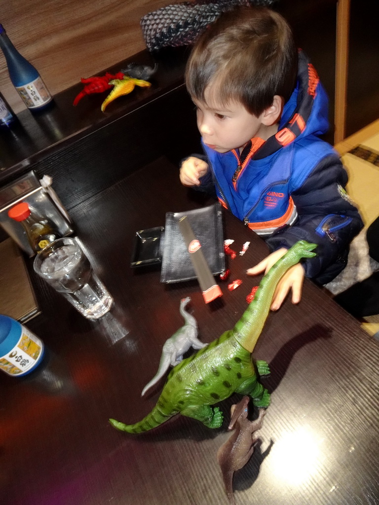 Max with dinosaur toys at the Tanuki restaurant at the Gelderlandplein shopping mall