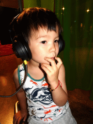 Max with headphones on at the Humania exhibition at the Fourth Floor of the NEMO Science Museum