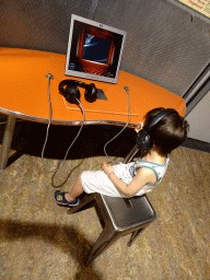 Max with headphones on at the Humania exhibition at the Fourth Floor of the NEMO Science Museum