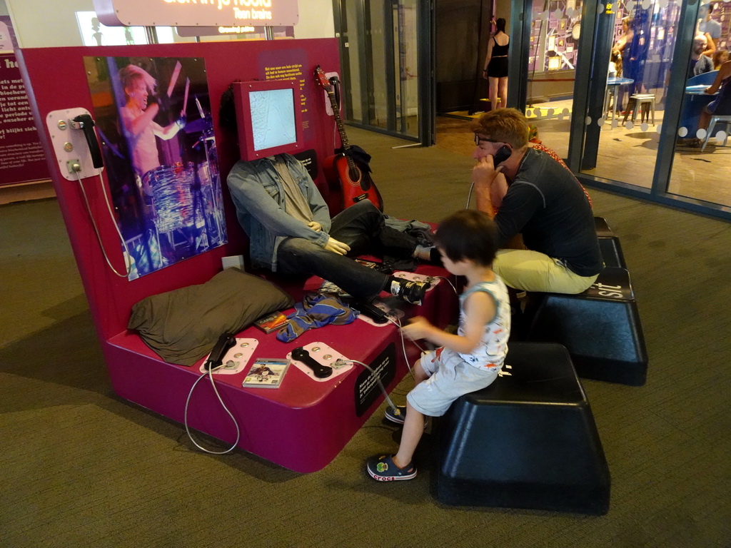 Max with a telephone at the Humania exhibition at the Fourth Floor of the NEMO Science Museum