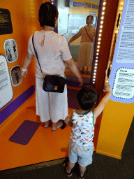Miaomiao and Max at a distorting mirror at the Humania exhibition at the Fourth Floor of the NEMO Science Museum