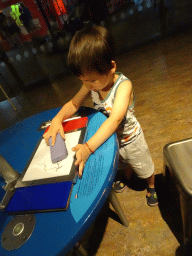 Max with a sketchpad at the Humania exhibition at the Fourth Floor of the NEMO Science Museum