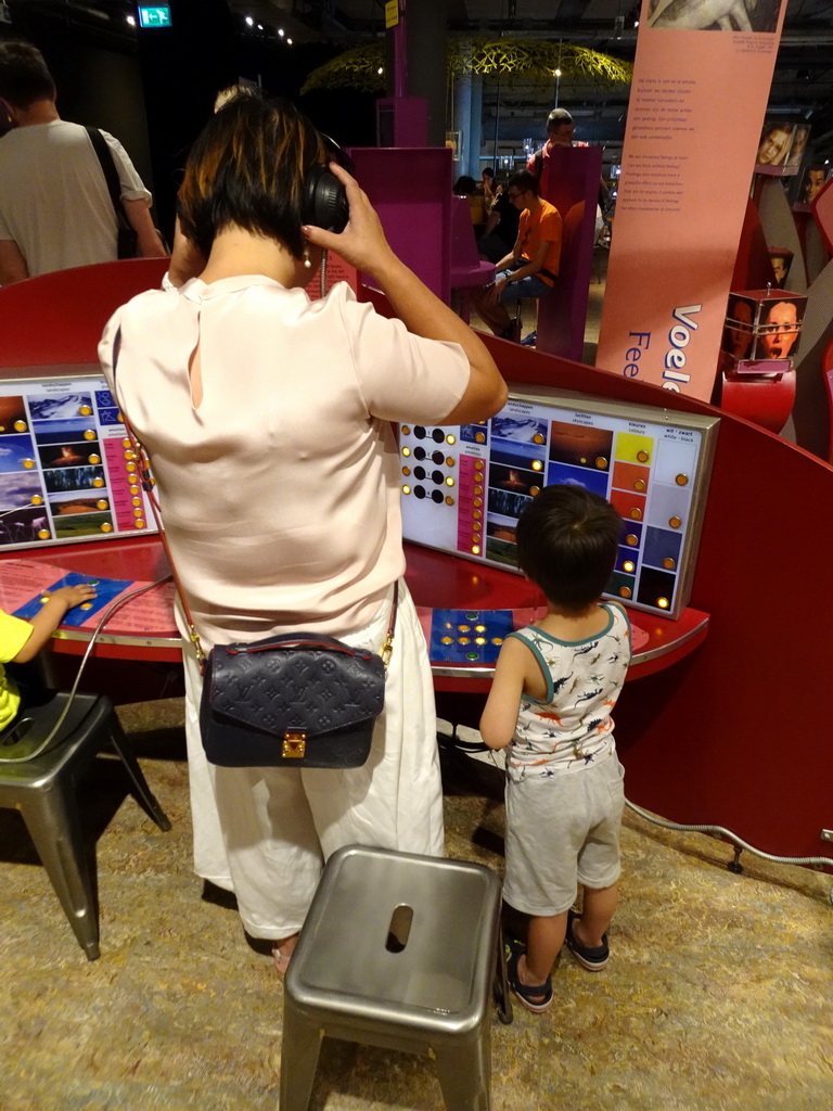 Miaomiao and Max doing an emotion game at the Humania exhibition at the Fourth Floor of the NEMO Science Museum