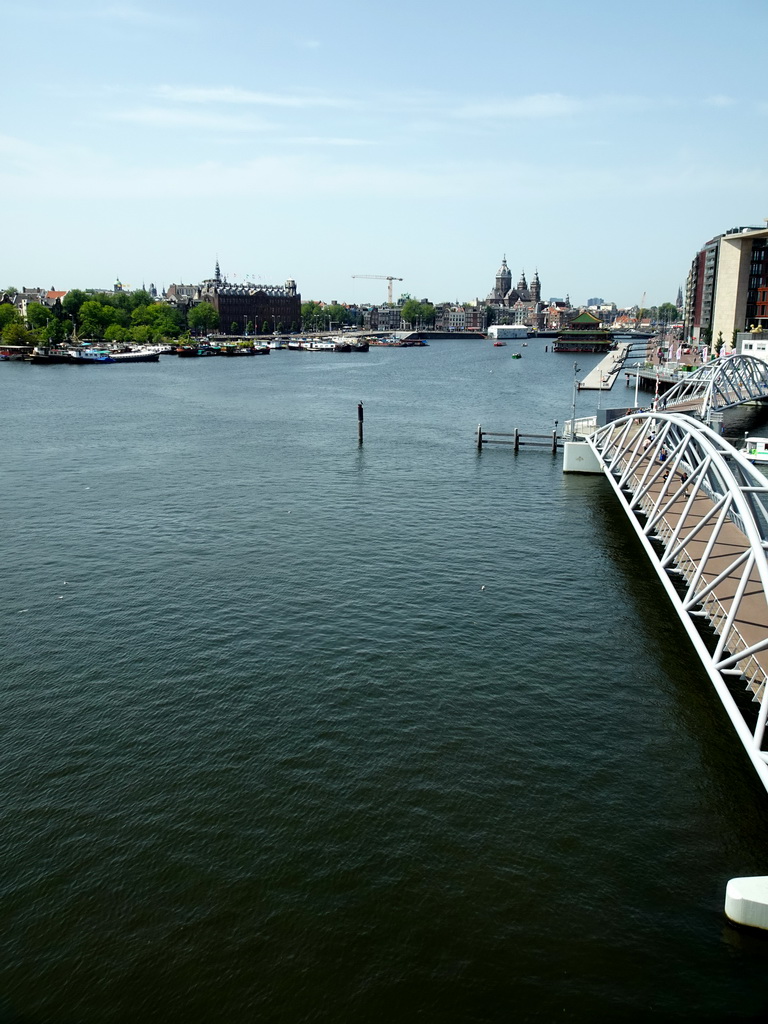 The Mr. J.J. van der Veldebrug bridge over the Oosterdok canal, the Grand Hotel Amrâth Amsterdam and the Oude Kerk church, viewed from the Third Floor of the NEMO Science Museum