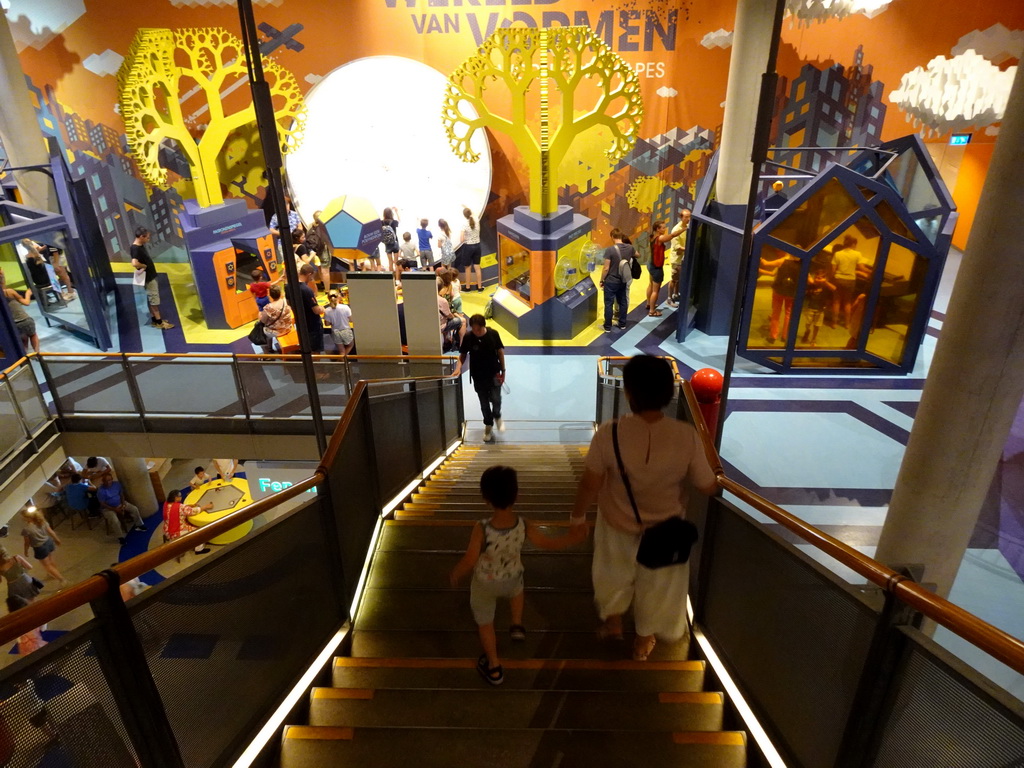 Miaomiao and Max on the staircase from the Third Floor to the Second Floor of the NEMO Science Museum